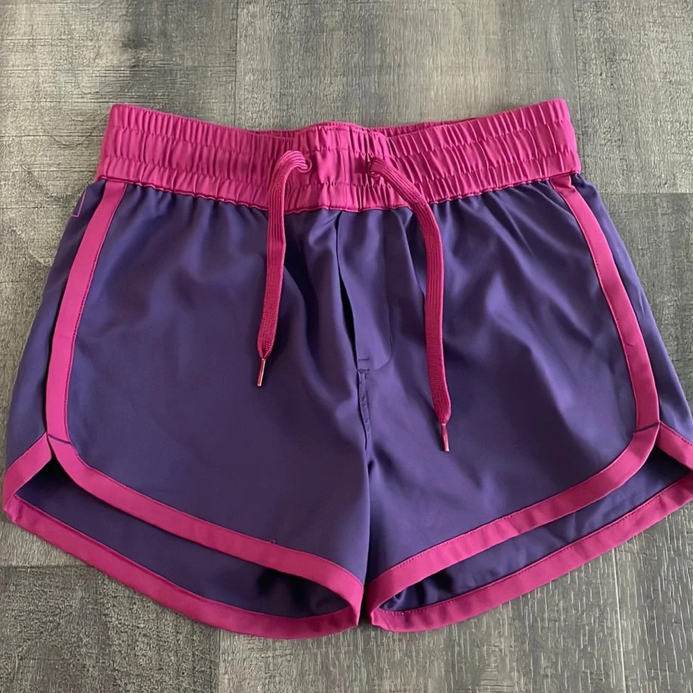 REI purple athletic shorts with fushia trim size 10/12